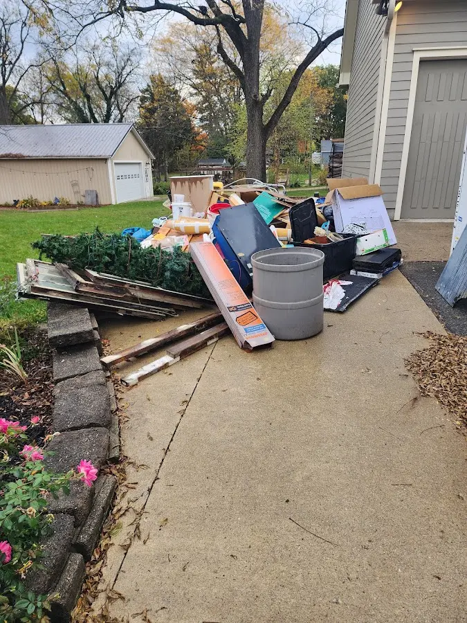 Dumpster being loaded with debris for 3 Yard Dumpster Rental in Lockland